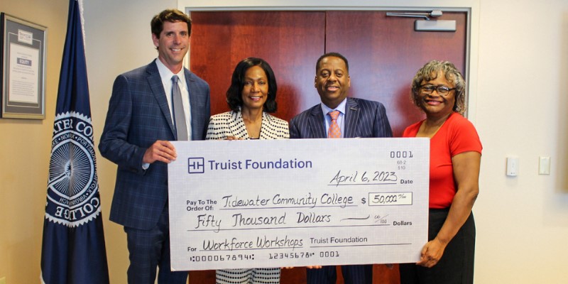 TCC President Conston with Truist Foundation executives during check presentation.
