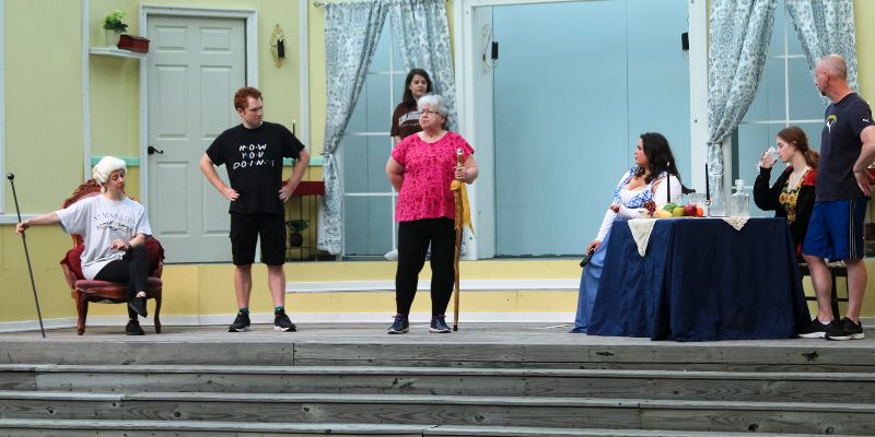 Cast members acting on the outdoor stage at Chesapeake Campus.